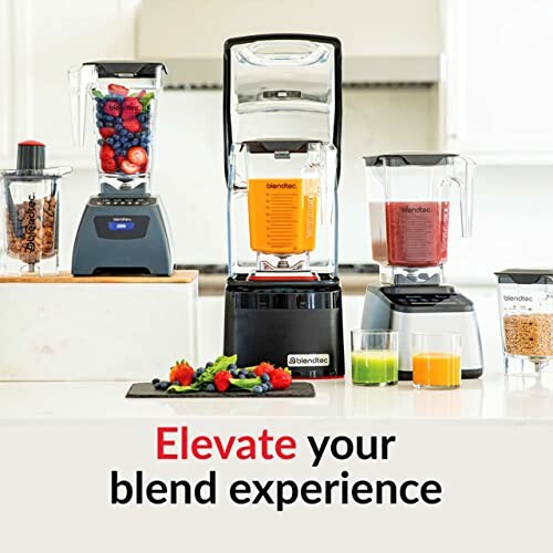 Blendtec blenders with fruits and juices on a kitchen counter.