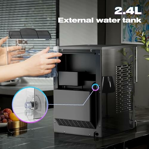 Compact ice maker with 2.4L external water tank in kitchen setting.