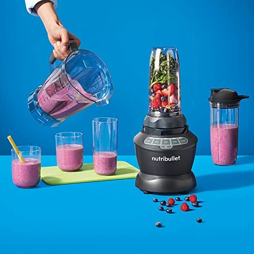 Nutribullet blender with smoothie ingredients and glasses