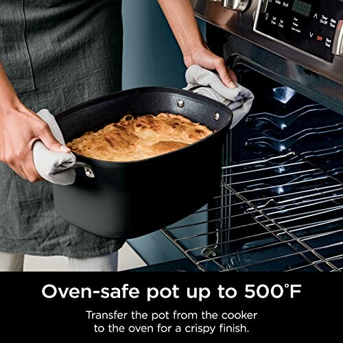 Person placing an oven-safe pot inside a heated oven.
